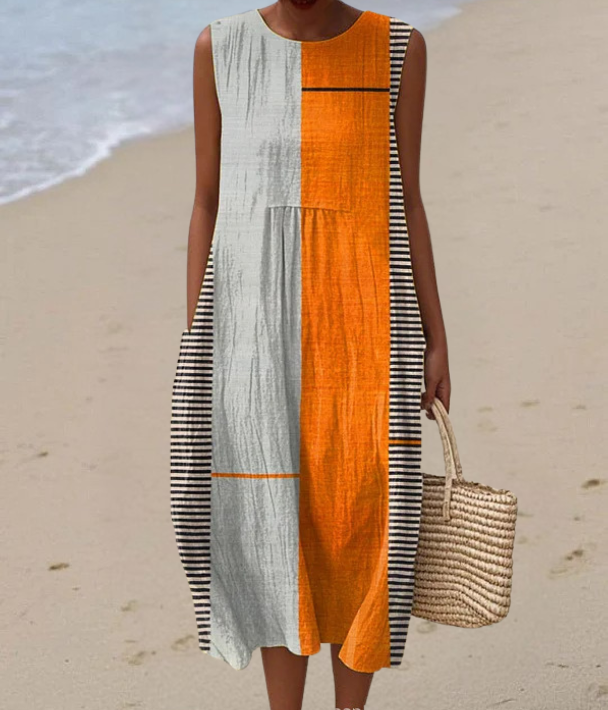 白地にオレンジのノースリーブドレス